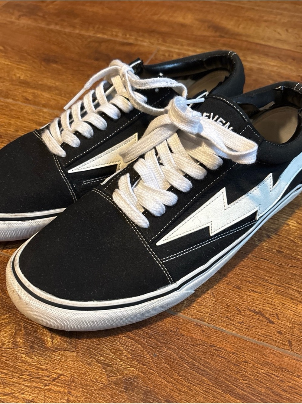 Revenge x Storm Black Low-Top Sneakers with White Lightning Accent